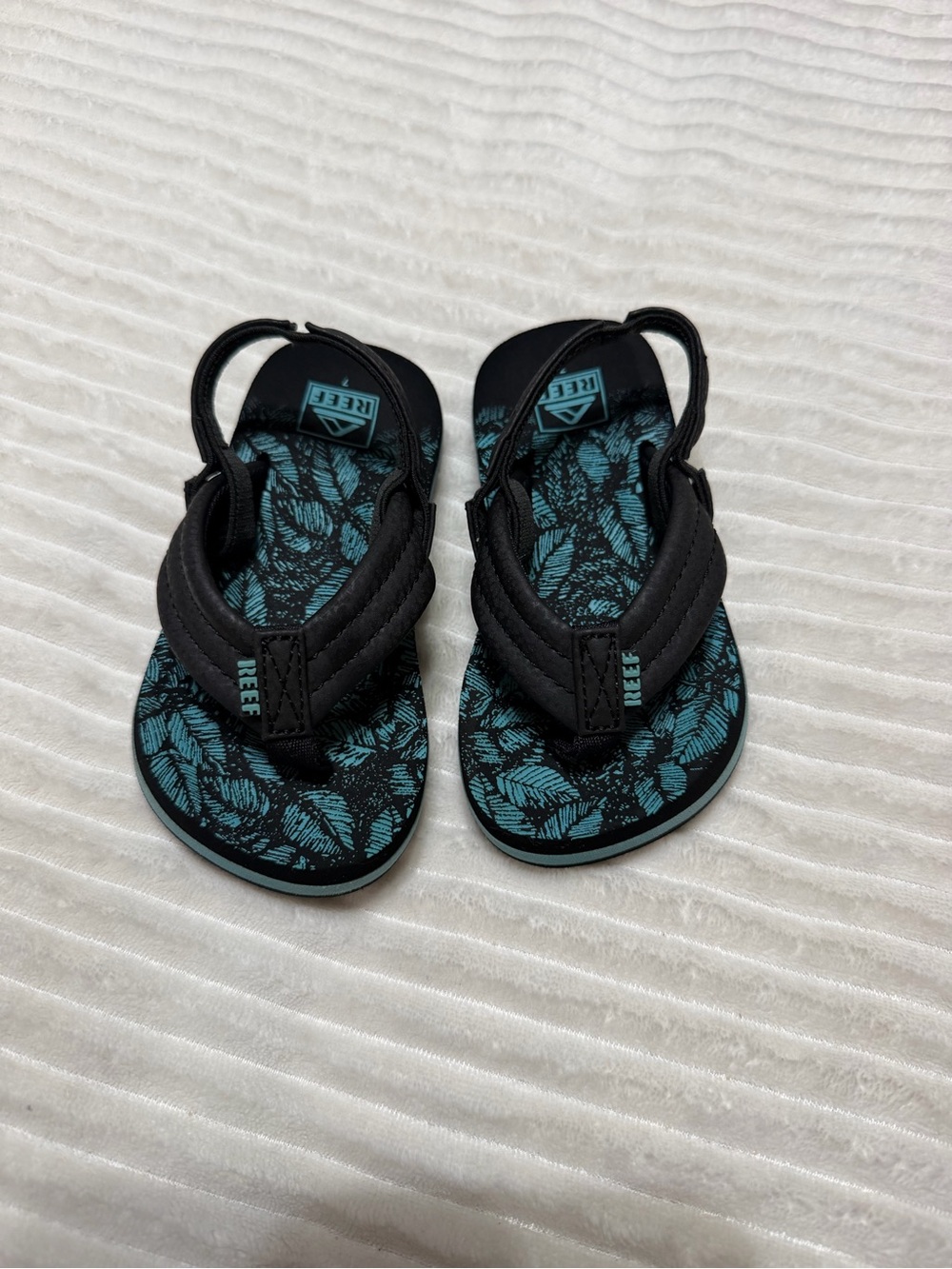 Reef Kids Black and Teal Leaf-Print Flip Flops